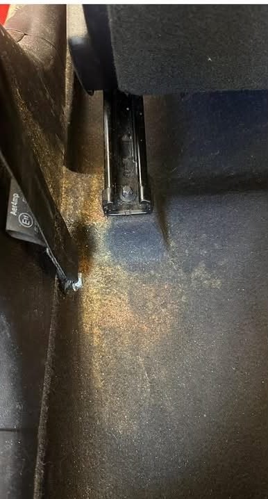 Rear floor carpet, before and after cleaning (before)