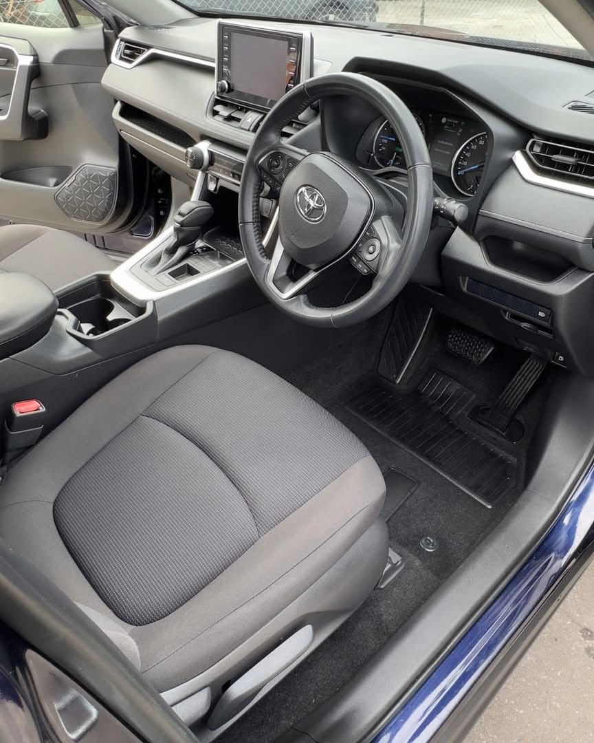 Clean Toyota interior with fabric seat and floor mats